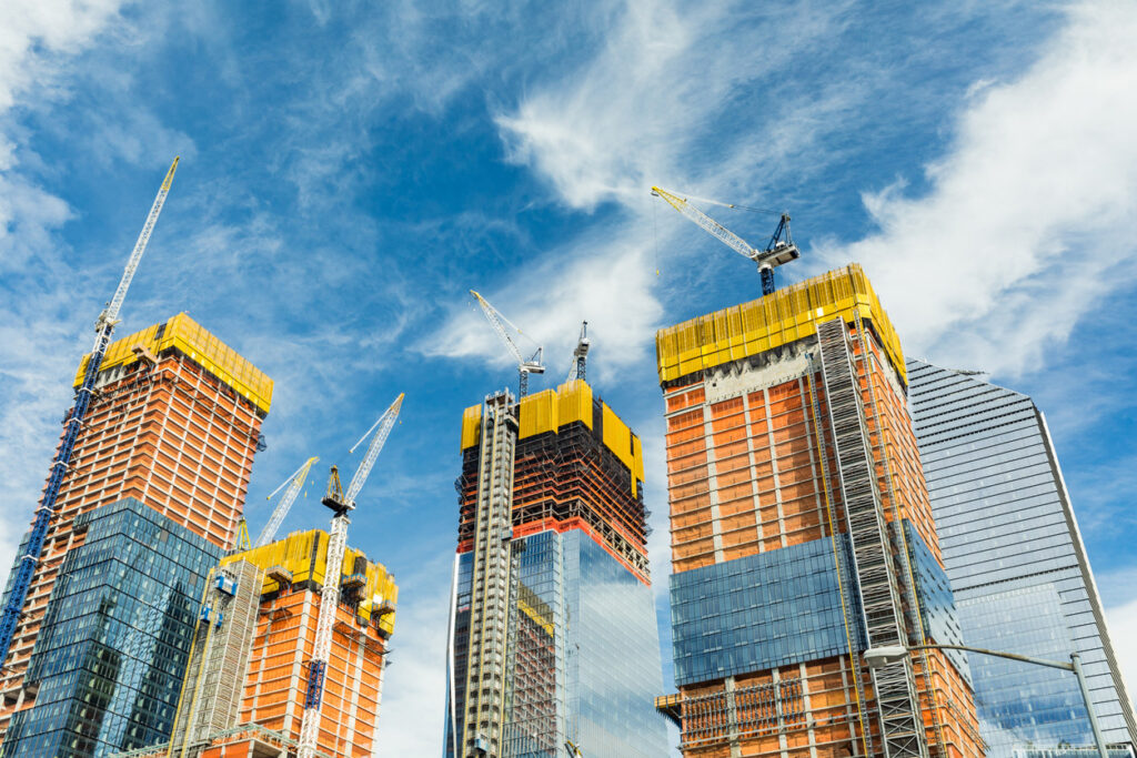 High-rise construction sites with tower cranes in New York City