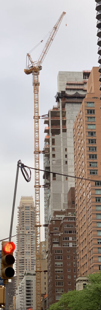 Tower crane beside a high-rise under construction in Manhattan