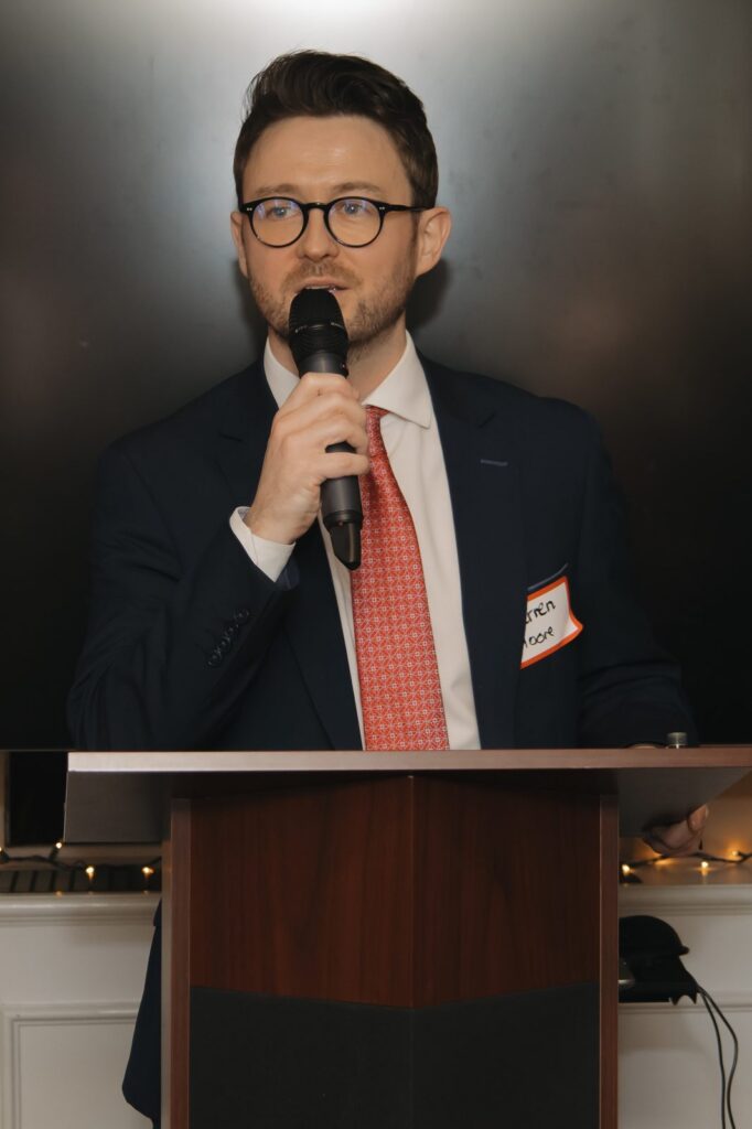 Darren T. Moore speaking at IABANY's Christmas party at NYU's Glucksman Ireland House