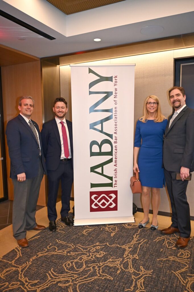 Darren T. Moore with guests beside the IABANY banner at the 2025 Wine Geese Awards