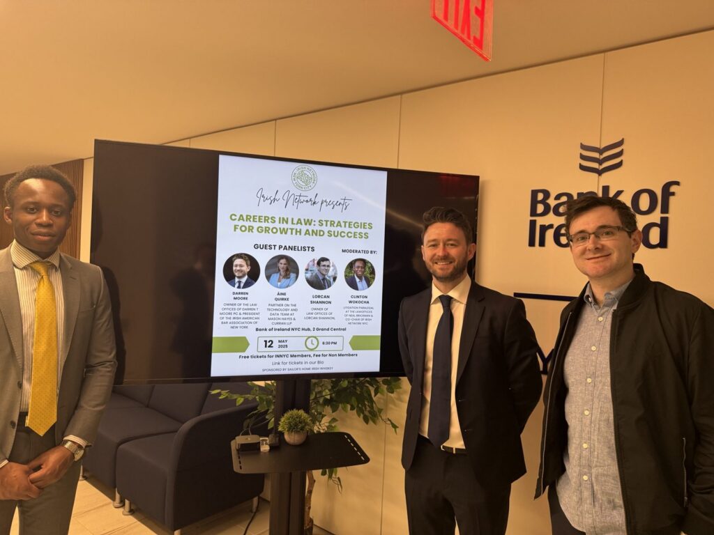 Clinton Wokocha, Darren T. Moore and Lorcan Shannon beside the Careers in Law event program
