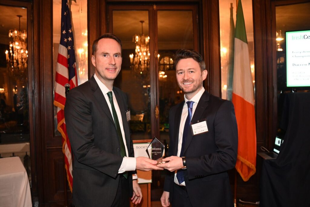 Darren T. Moore receives the Ecosystem Engagement Champion of the Year award from IrishCentral Chair Liam Lynch at the IrishCentral Legal Elite Awards 2024